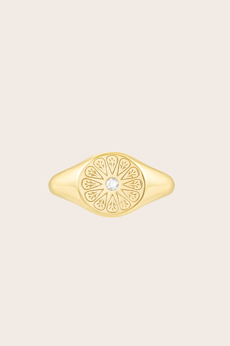Gold April Birthstone Ring on cream background