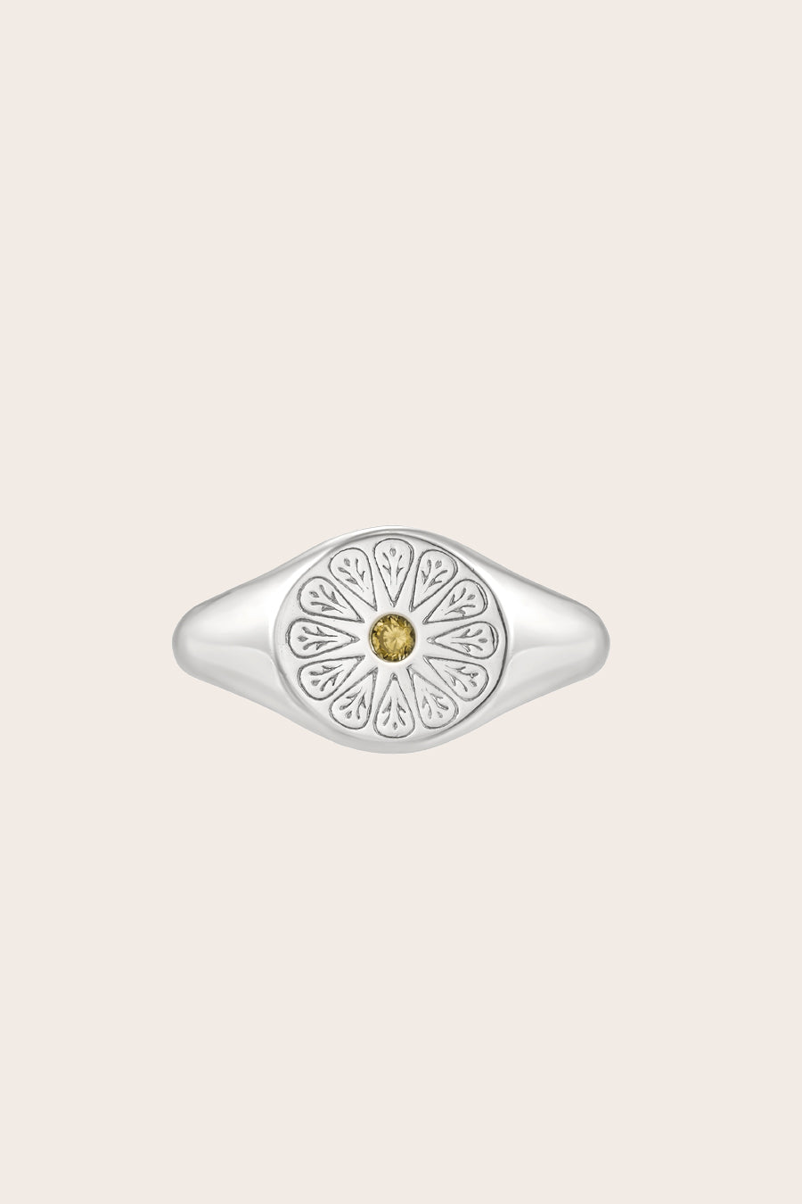 Silver August Peridot Signet Birthstone Ring on cream background