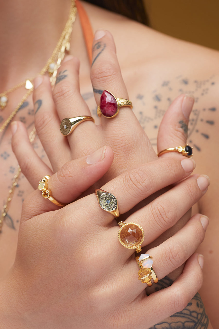 Gold January Garnet Signet Birthstone Ring worn on hands