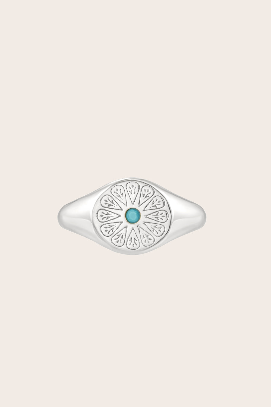 Silver Turquoise Birthstone Signet Ring on cream background