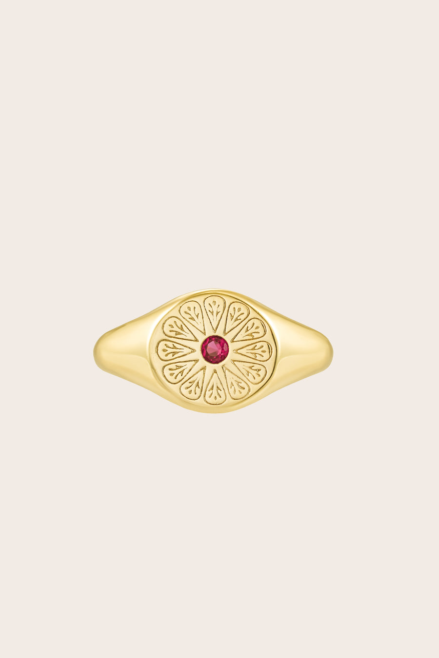 Gold July Ruby Signet Birthstone Ring on cream background