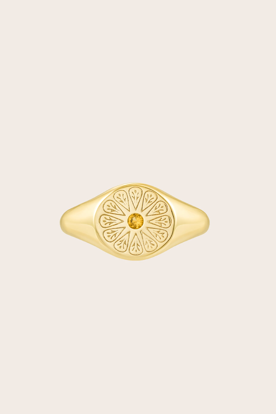 Gold November Citrine Signet Birthstone Ring on cream background